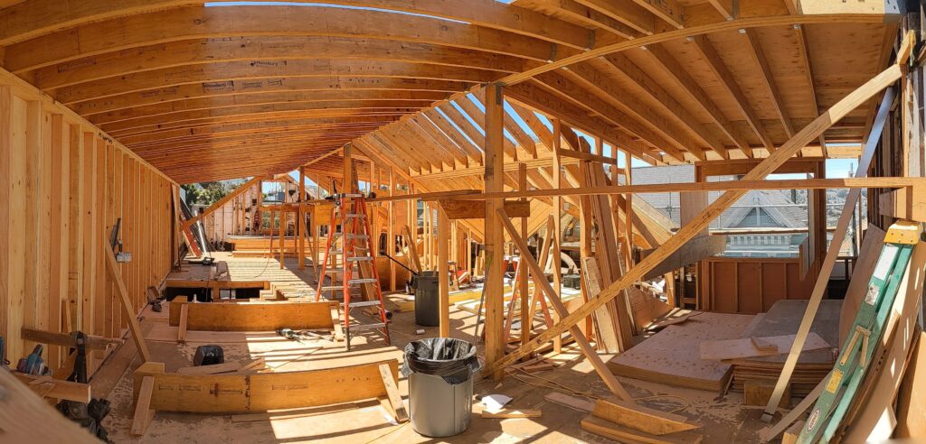 image showing framing stage of a third floor with vaulted ceilings
