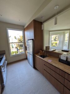 a kitchen with a sink and a refrigerator